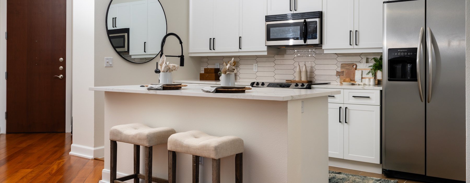 a kitchen with white cabinets