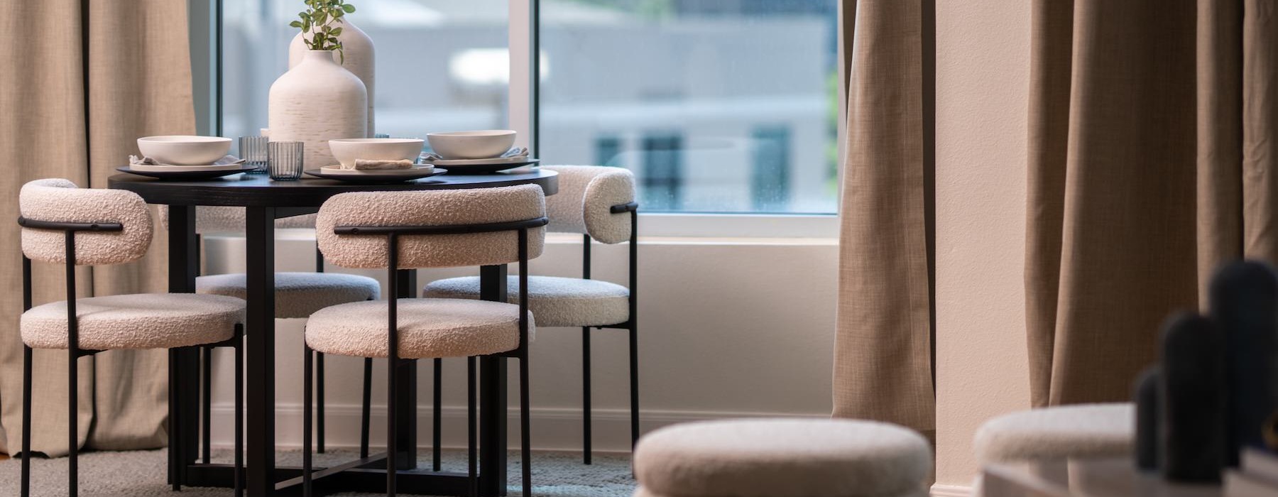 a table with chairs and a window